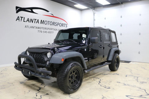 Used 2014 Jeep Wrangler Unlimited Sport image 1